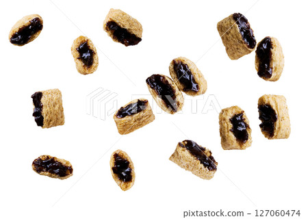 corn pads filled with chocolate cream isolated on white background. corn pads filled with chocolate cream isolated on white background. 127060474
