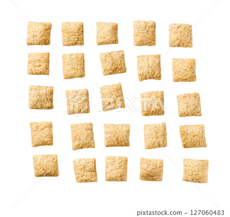 Tasty corn pillows isolated on white background top view. 127060483