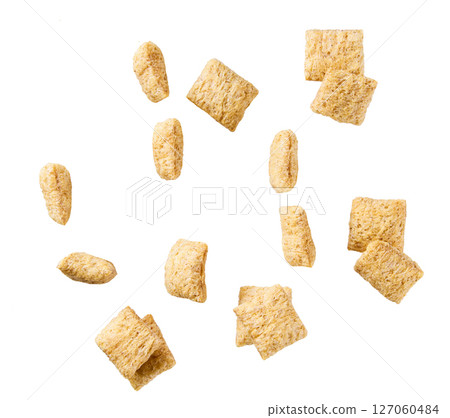 Tasty corn pillows isolated on white background top view. 127060484