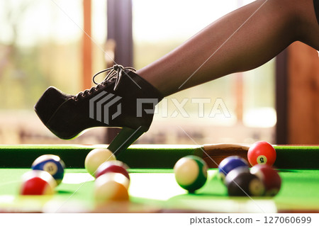 Young woman posing having fun with billiard. Young woman posing having fun with billiard. 127060699