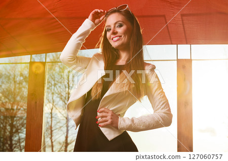 Young woman having fun on sunny day. 127060757