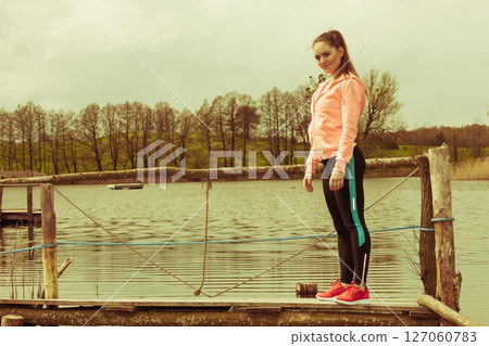 Young sports woman taking break after a run. 127060783