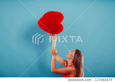 Woman with heart shape pillow. Valentines day love Woman with heart shape pillow. Valentines day love 127060879