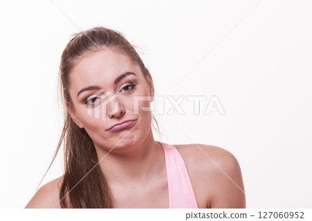 Sporty girl making silly faces. 127060952