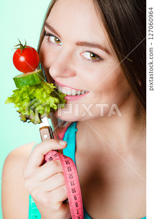 Young fit woman with vegetables. Young fit woman with vegetables. 127060964