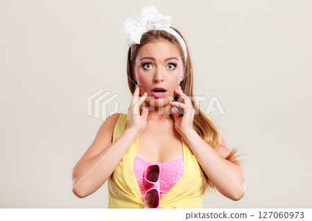 Amazed surprised pin up girl with mouth wide open. 127060973