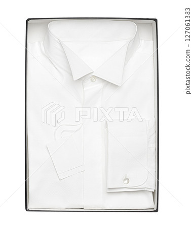 Classic white shirt with cuffs for cufflinks in the box on a white background Classic white shirt with cuffs for cufflinks in the box on a white background 127061383