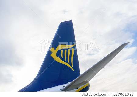 3 January - Porto, Portugal: White-blue-yellow aircraft tail with Ryanair logo 3 January - Porto, Portugal: White-blue-yellow aircraft tail with Ryanair logo 127061385