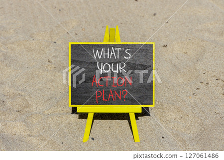 Action plan symbol. Concept words What is your action plan on beautiful black blackboard. Beautiful sand background. Business What is your action plan concept. Copy space 127061486