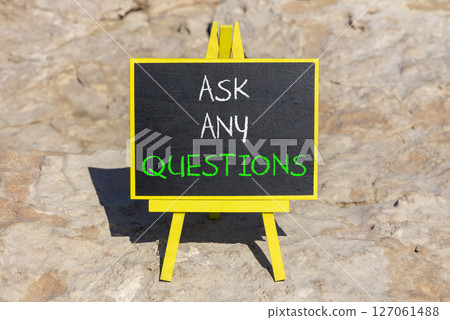 Ask any questions symbol. Concept words Ask any questions on beautiful black yellow blackboard. Beautiful stone background. Business ask any questions concept. Copy space. 127061488