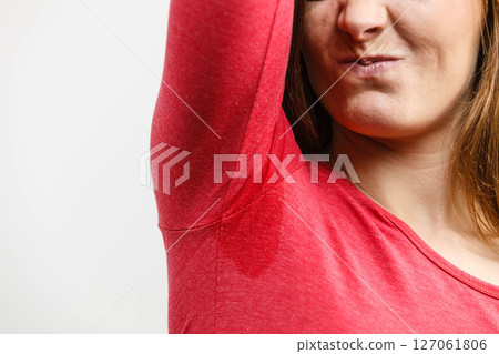 Woman showing her wet armpit Woman showing her wet armpit 127061806