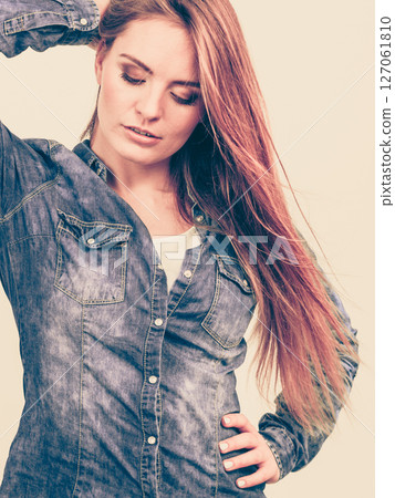 Fashionable woman with blowing hair Fashionable woman with blowing hair 127061810