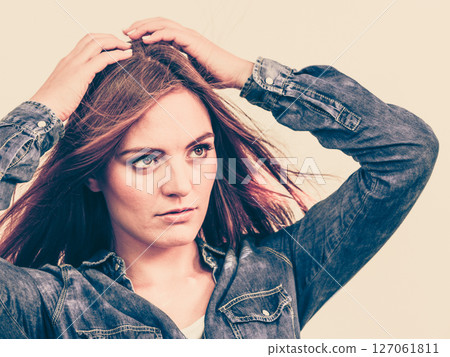 Fashionable woman with blowing hair Fashionable woman with blowing hair 127061811