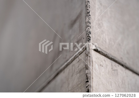 Selective focus on the weld bead and ground joint of stainless steal plats on the Gateway Arch National Park in St. Louis, Missouri Selective focus on the weld bead and ground joint of stainless steal plats on the Gateway Arch National Park in St. Louis, Missouri 127062028