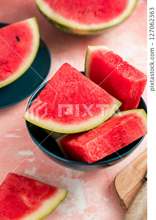 Slices of fresh watermelon fruit in a bowl 127062363