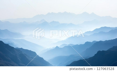 A Misty Mountain Range in Blue Hues A Misty Mountain Range in Blue Hues 127063528