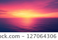 Pink and Orange Sunset Over a Calm Ocean 127064306