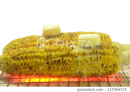 Cooking corn butter on a charcoal grill Cooking corn butter on a charcoal grill 127064535