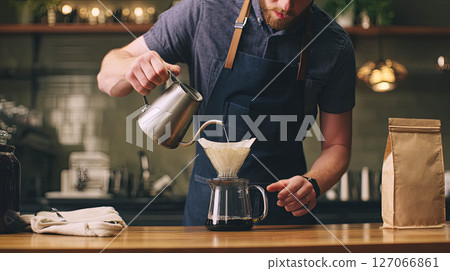 Brewing aromatic coffee with pour-over method in a cozy kitchen setting showcasing coffee culture concept 127066861