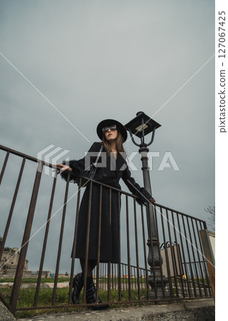 Elegant Women Posing On The Railing In The Medieval Italian Town Square 127067425