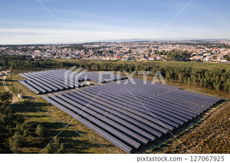 Drone view of solar panels in fields, generating 127067925