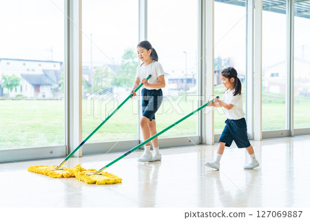 Girl cleaning the gym Girl cleaning the gym 127069887