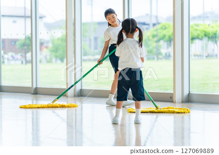 Girl cleaning the gym Girl cleaning the gym 127069889
