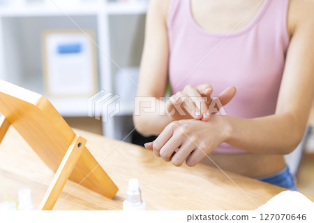 Beauty image: A woman's hand holding cosmetics Beauty image: A woman's hand holding cosmetics 127070646