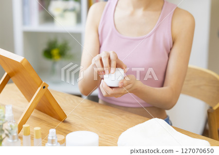 Beauty image: A woman's hand holding cosmetics 127070650