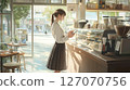 A woman working in a cafe 127070756