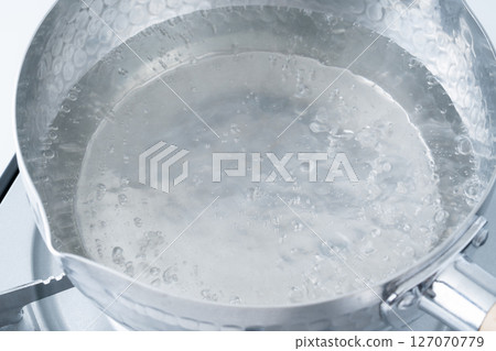 Boiling water in a pot 127070779