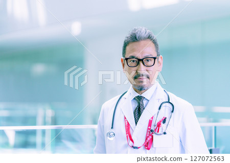 Portrait of a doctor standing in a hospital corridor Photo courtesy of Sky Perfect Tokyo Media Center Portrait of a doctor standing in a hospital corridor Photo courtesy of Sky Perfect Tokyo Media Center 127072563