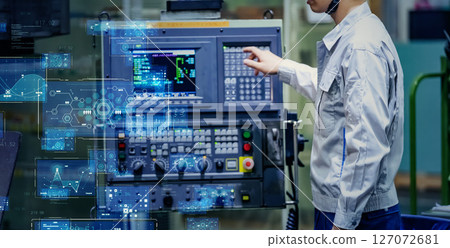 Digital technology concept with worker operating control panel in factory 127072681