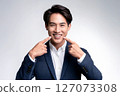 A good-looking young Japanese man with healthy white teeth 127073308