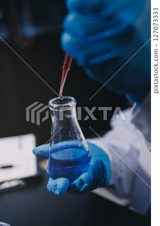 scientist working at the laboratory scientist working at the laboratory 127073333