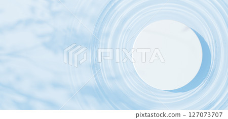 A white cylinder pedestal floating on the water surface. Ripples. Shadows of leaves. Bird's-eye view. Copy space. 3D (landscape) 127073707