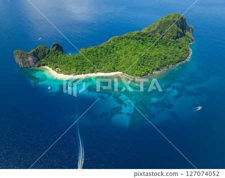 Helicopter Island with beach and blue sea with boats. El Nido, Philippines. Helicopter Island with beach and blue sea with boats. El Nido, Philippines. 127074052