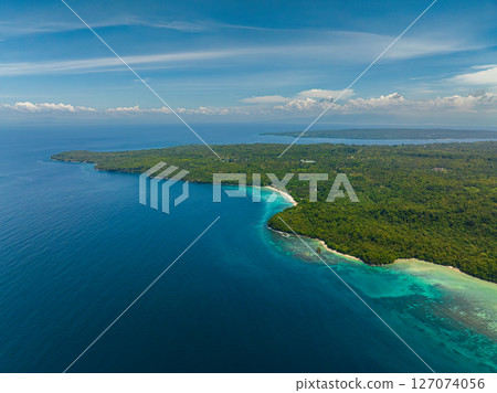 Beautiful ocean waves splashing the shoreline. Samal, Davao. Philippines. Beautiful ocean waves splashing the shoreline. Samal, Davao. Philippines. 127074056