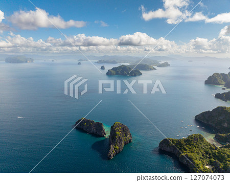 Twin Rocks and Miniloc Island with boats and kayaks. El Nido, Palawan. Philippines. 127074073