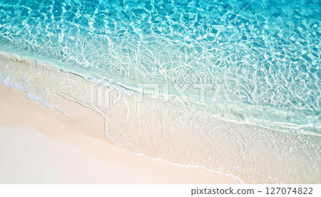 waves on the beach, sea water background, High angle view of crystal clear water gently washing over pure white sand, creating a calm, tropical seaside pattern perfect for natural background 127074822