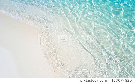 waves on the beach, sea water background, High angle view of crystal clear water gently washing over pure white sand, creating a calm, tropical seaside pattern perfect for natural background 127074829