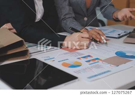 Accounting company provide finance and taxation planning for profitable cash flow, Auditor and accountant team working in office, analyze financial data and accounting record with calculator.Insight Accounting company provide finance and taxation planning for profitable cash flow, Auditor and accountant team working in office, analyze financial data and accounting record with calculator.Insight 127075267