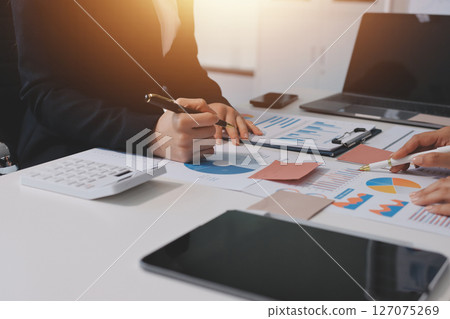 Accounting company provide finance and taxation planning for profitable cash flow, Auditor and accountant team working in office, analyze financial data and accounting record with calculator.Insight Accounting company provide finance and taxation planning for profitable cash flow, Auditor and accountant team working in office, analyze financial data and accounting record with calculator.Insight 127075269