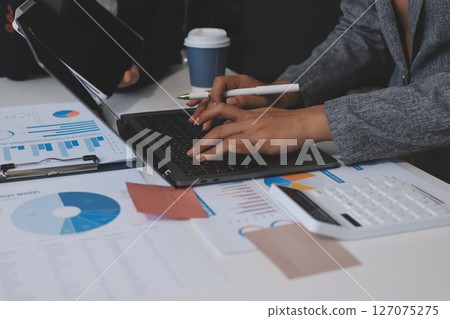 Accounting company provide finance and taxation planning for profitable cash flow, Auditor and accountant team working in office, analyze financial data and accounting record with calculator.Insight Accounting company provide finance and taxation planning for profitable cash flow, Auditor and accountant team working in office, analyze financial data and accounting record with calculator.Insight 127075275
