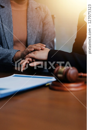 Judge gavel with Justice lawyers having team meeting at law firm background. Concepts of Law and Legal services. Judge gavel with Justice lawyers having team meeting at law firm background. Concepts of Law and Legal services. 127075323
