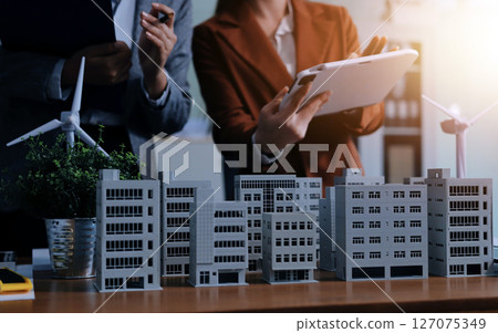 Discussion among businesspeople on the latest developments in solar cell panel technology and Solar Energy Environment city Concept. Discussion among businesspeople on the latest developments in solar cell panel technology and Solar Energy Environment city Concept. 127075349