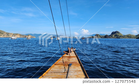 Sailing on the blue ocean towards the islands Sailing on the blue ocean towards the islands 127075548