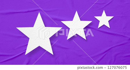 White paper stars, isolated on purple crumpled paper background. 127076075