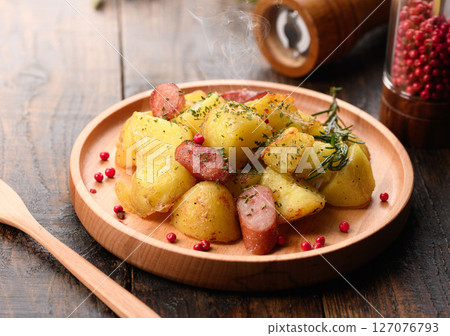 Sauteed potatoes and wieners with garlic Sauteed potatoes and wieners with garlic 127076793
