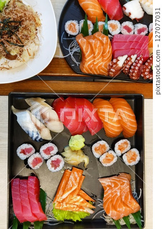 Closeup of fresh sushi on ceramic dish Closeup of fresh sushi on ceramic dish 127077031